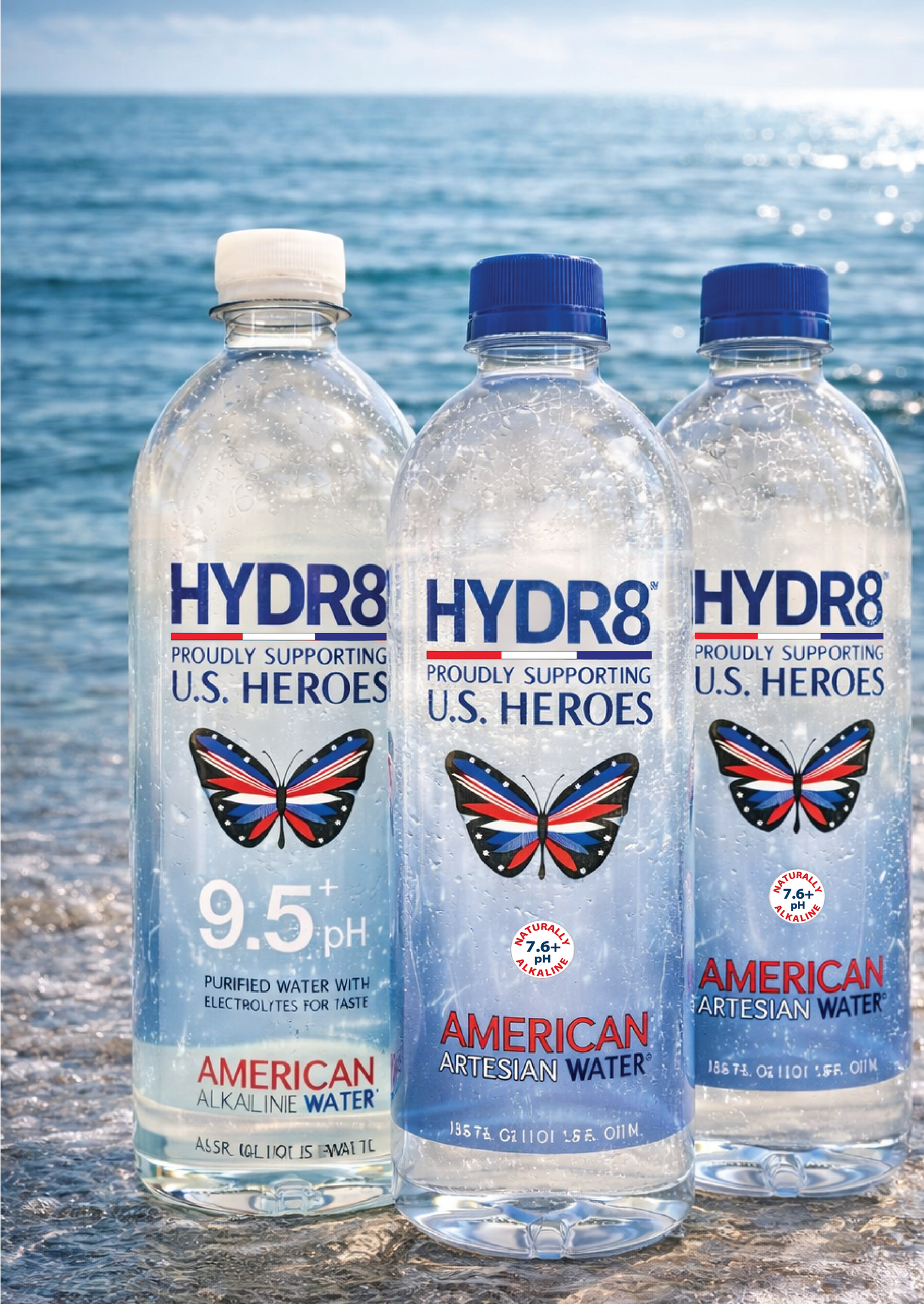Three bottles of HYDR8 water with butterfly designs on a beach background